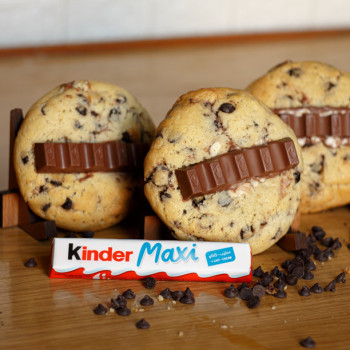 Discover the joy of surprise in every bite with our Kinder Chocolate Chip Cookie!